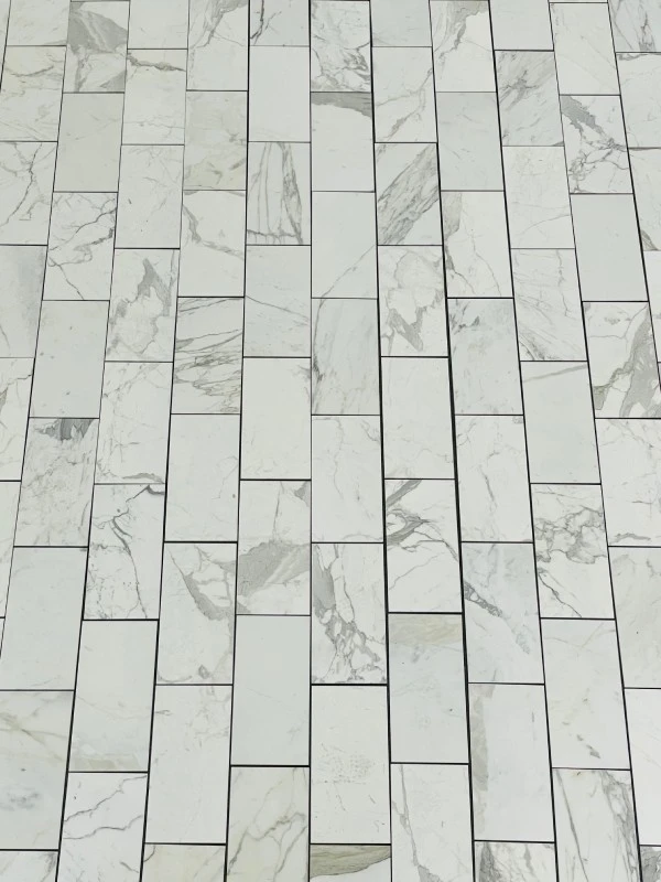 white marble shower tile